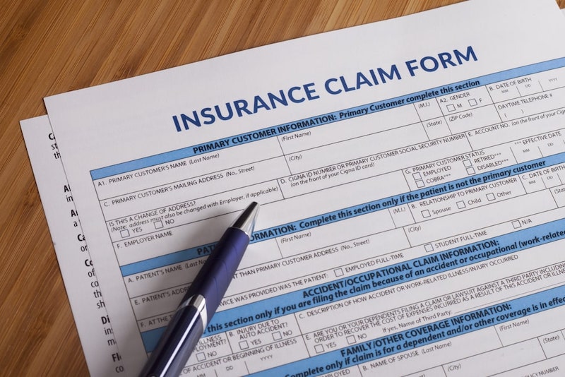 Insurance Claim Form Paperwork On The Table